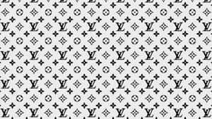 Enhance Your Look With The Timeless Elegance Of Louis Vuitton Print Wallpaper