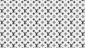 Enhance Your Look With The Timeless Elegance Of Louis Vuitton Print Wallpaper