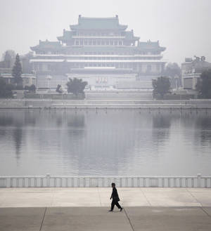 Enigmatic Foggy Morning Over Kim Il-sung Square In Pyongyang Wallpaper