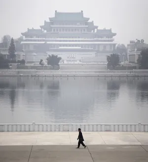 Enigmatic Foggy Morning Over Kim Il-sung Square In Pyongyang Wallpaper