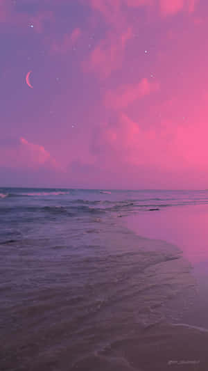 Enjoy A Beautiful Beach Sunset With A Pink And Tranquil Aesthetic. Wallpaper