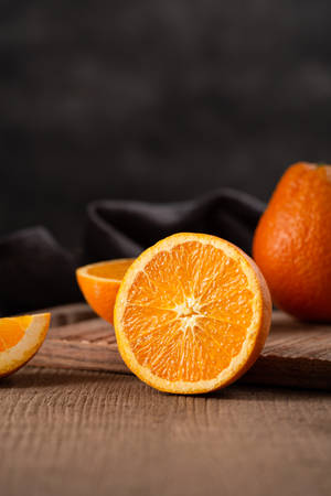 Enjoy A Delicious Orange Slice Wallpaper