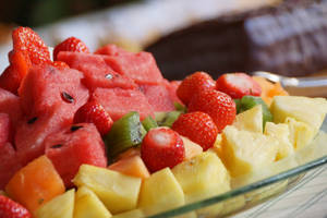 Enjoy A Healthy And Delicious Fruit Salad Featuring Sweet Pineapple. Wallpaper