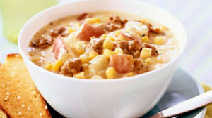 Enjoy A Hearty Beefy Chowder With Corn Wallpaper