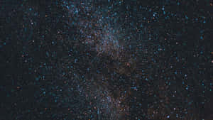 Enjoy A Mesmerizing View Of The Night Sky Wallpaper