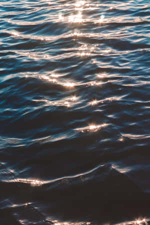 Enjoy A Relaxing View Of The Ocean With This Stunning Wallpaper For Your Phone Wallpaper