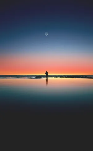 Enjoy A Warm Sunset On The Beach With Your Iphone Wallpaper