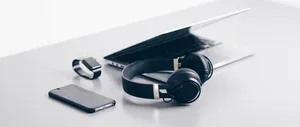 Enjoy Music And Technology With A Laptop And Headphones Wallpaper