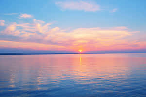 Enjoy Peace And Relaxation On A Beautiful Pastel Beach Wallpaper