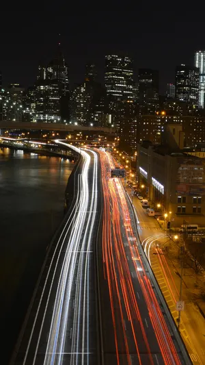 Enjoy The Beauty Of Nature With This Time Lapse Of Clouds Rolling In Over A Lush Green Landscape Wallpaper