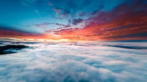Enjoy The Dramatic Colors Of A Cloud-filled Horizon. Wallpaper