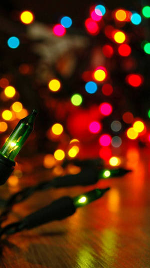 Enjoy The Magical Christmas Lights On Your Iphone! Wallpaper