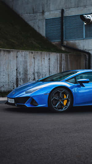 Enjoy The Ride Of Luxury In A Blue Lamborghini Wallpaper