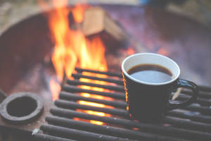 Enjoy The Smoky And Rich Aroma Of Freshly Roasted Coffee. Wallpaper