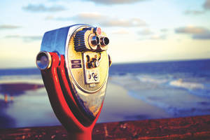 Enjoy The Stunning View Of Santa Ana, Orange County From Afar With Binoculars. Wallpaper