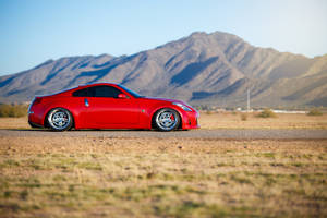 “enjoy The Thrill Of The Drive With The Powerful Nissan 350z” Wallpaper