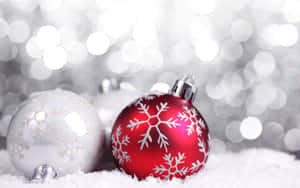 Enjoy The Yuletide Season With Friends And Family Surrounded In A Blanket Of Freshly Felled Snow. Wallpaper