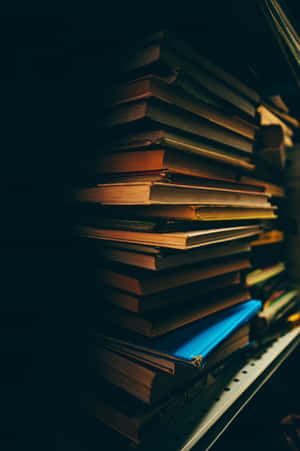 Enjoy Your Favorite Books On The Go With Your Iphone Wallpaper