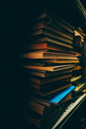 Enjoy Your Favorite Books On The Go With Your Iphone Wallpaper