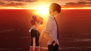 Enjoying A Beautiful, But Sad Sunset Together Wallpaper