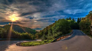 Enjoying A Peaceful Sunset Drive Wallpaper