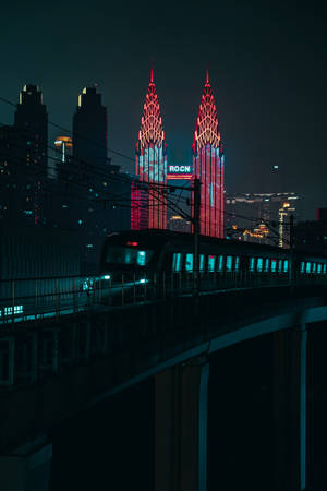 Enjoying The Lights Of London From A Train At Night Wallpaper