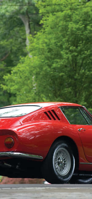 Enjoying The Ride In This Vintage Ferrari Wallpaper