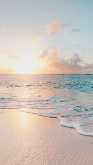Enjoying The Summer Sun Lounging On The Beach Wallpaper