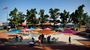 Enjoying The Sunlight In Downtown Garland Square Wallpaper