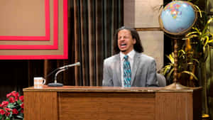 Eric Andre Show Desk Laugh Wallpaper