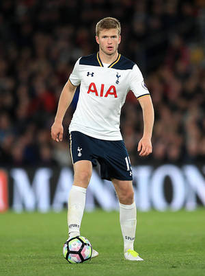 Eric Dier Standing On Football Field Wallpaper