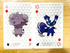 Espurr And Meowstic Pokémon Playing Cards Wallpaper