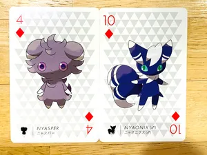 Espurr And Meowstic Pokémon Playing Cards Wallpaper