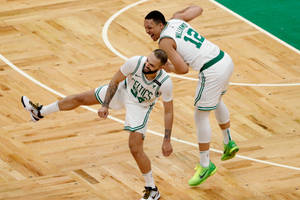 Evan Fournier And Grant Williams Wacky Jump Wallpaper