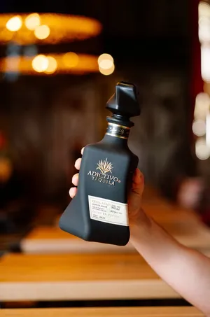 Expensive Bottle Of Adictivo Tequila Wallpaper