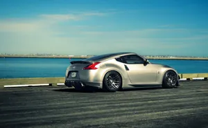 Experience The Ocean While Driving A Jdm Nissan 370z Wallpaper