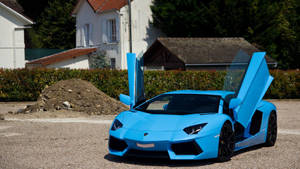 Experience The Ultimate Thrill Of Driving A Sky Blue Lamborghini Aventador Wallpaper