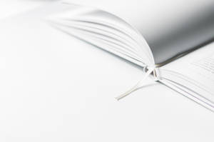 Explore Your Ideas With This Blank Open Book Wallpaper