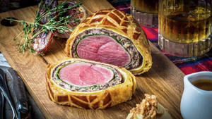 Exquisite Beef Wellington - A True Culinary Delight Wallpaper