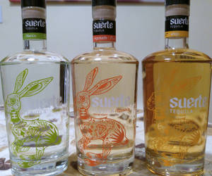 Exquisite Collection Of Suerte Tequila Bottles Wallpaper