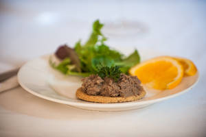 Exquisite Liver Spread On Biscuit Paired With Fresh Oranges Wallpaper