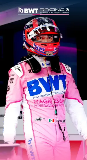 F1 Race Driver Sergio Perez In Pink Race Suit Wallpaper