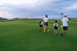 Family At The Golf Course Wallpaper