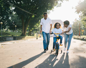 Family Biking Lesson Wallpaper