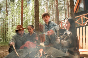 Family Camping In The Woods Wallpaper