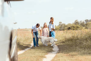 Family Trip Grass Field Wallpaper