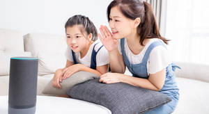 Family Using Smart Speaker Wallpaper