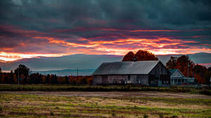 Farmhouse In An Empty Field Wallpaper