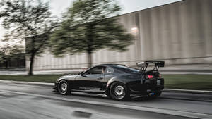 Fast Moving Black Toyota Supra Wallpaper