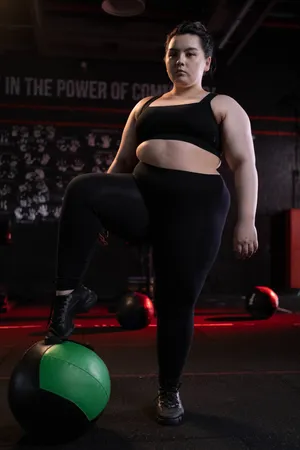 Fat Girl In A Black Gym Attire Wallpaper